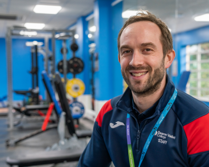 Image of Curriculum Team Leader, Stuart Prentice sitting in the gym.