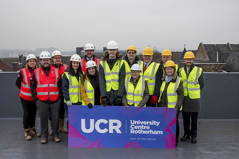 A group of people stood on the roof of the UCR