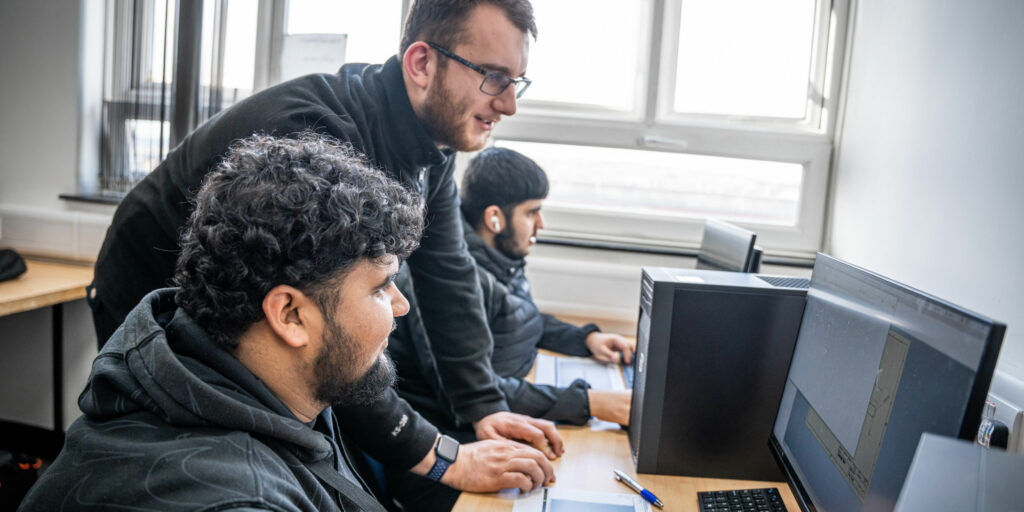 Engineering students in class at computers