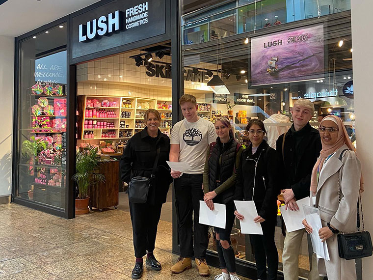Graphics students stood outside Lush store