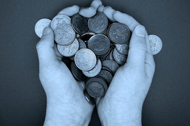 Hands holding coins
