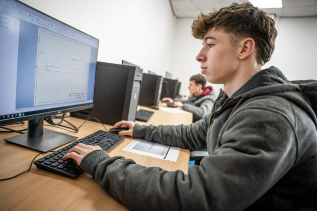 A student sat at a computer