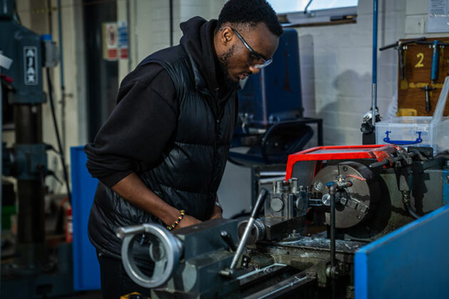 An engineering student working in the workshop