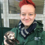 UCR Animal Management student Finn holding an animal