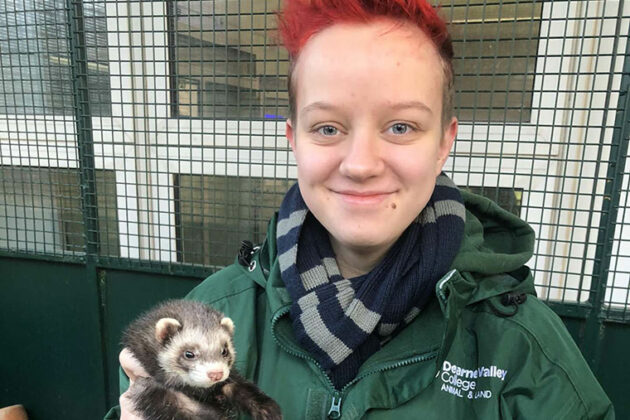 UCR Animal Management student Finn holding an animal