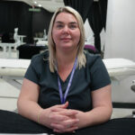 Student Lucy, sat in a beauty salon setting