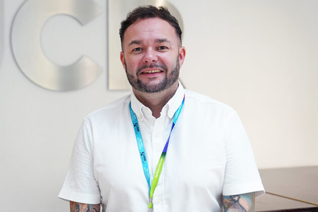 Conal White, Accounting Tutor - male with short dark hair wearing a white short sleeved shirt